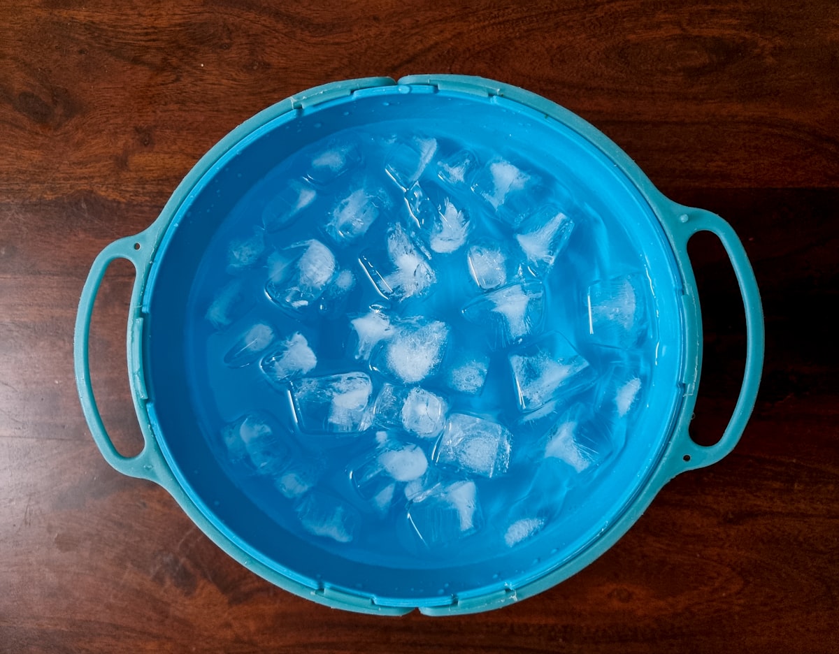 An ice bin filled with clean cubed ice, the output of a well-maintained Golden Beach ice machine