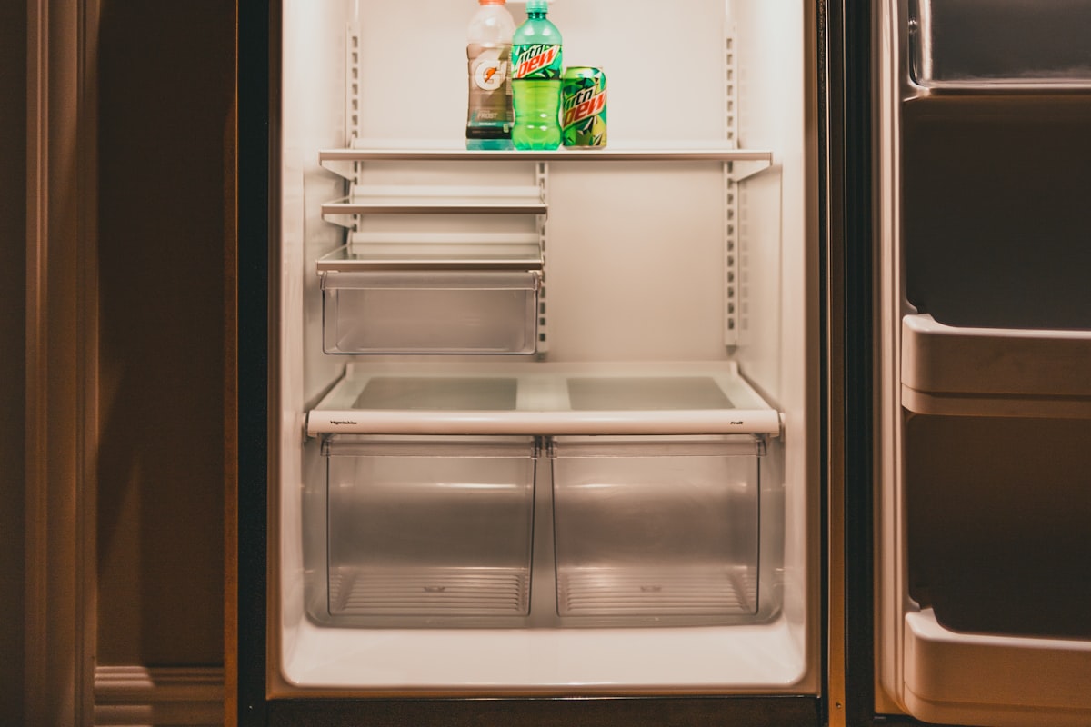 A refrigerator with an integrated ice and water dispenser in a Golden Beach kitchen