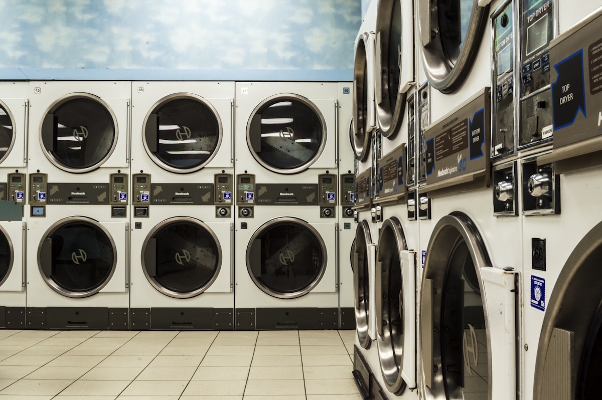 A matching washer and dryer pair installed in a bright laundry room