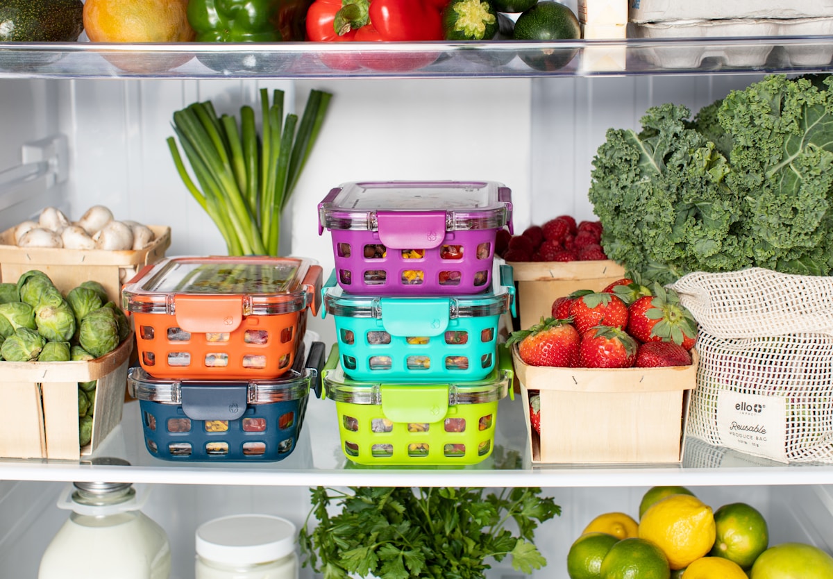 A refrigerator interior stocked with fresh produce, berries, and greens that must stay below 40 degrees in a Doral home
