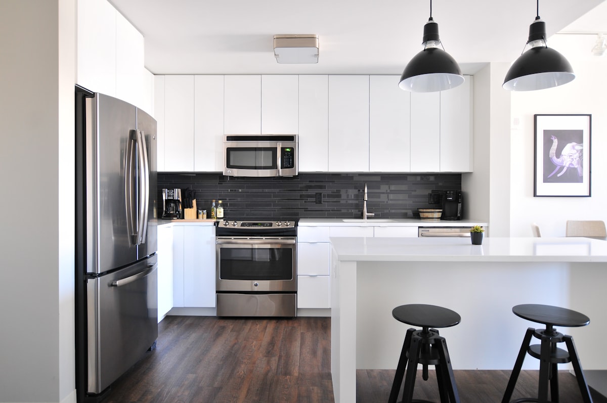 A stainless steel French-door refrigerator in a modern Bal Harbour luxury kitchen