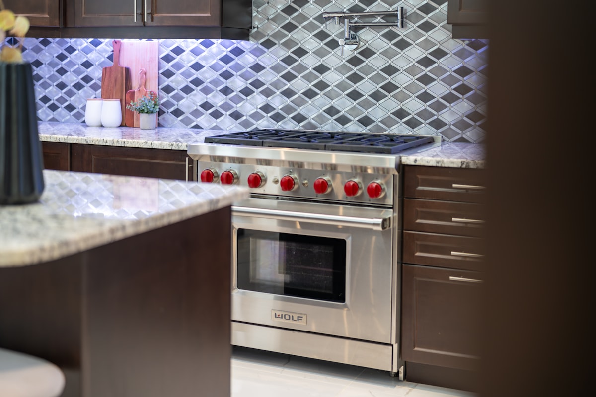 A modern stainless steel professional-grade gas range installed in a Miami kitchen